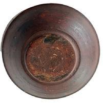 L142 Early 19th century hand turned wooden bowl bearing red over original red painted surface with prominently lipped rim and evidence of slow lathe turnings throughout. Bowl rests on a slightly footed base and retains great natural patina interior with wear indicative of years of use. Out of round. Measurements: 9 ¾ x 10 diameter x 2 ½ 2 ¾ tall (depending on where measured).