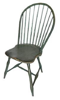 L123 Late 18th century Pennsylvania Bow Back Windsor chair with nine spindle back and bamboo turnings in old Windsor green painted surface. Great wear from years of use. Measurements: 15 1/2" wide across front of seat x 16" deep seat x 36 1/2" tall back. The seat is 17" tall.