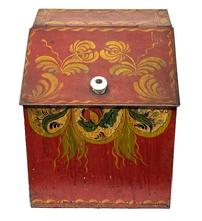 M1105 Tin countertop bin for storing Tea. The tole painted decoration is hand painted in mustard, green and black on a red-colored background. Original white porcelain knob remains intact on slanted hinged lid. Measurements: 10 wide x 10 deep x 11 tall (back) x 8 tall (front).