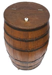 L350 Late 19th century Country Store Barrel with hinged lid retaining original porcelain knob. Natural patina surface, with no evidence of ever being painted. Vertical steamed and bent wooden staved construction secured with six horizontal iron bands. Original porcelain casters remain intact on bottom. Circa 1870s-1890s. Measurements: 15 ½ top diameter x 26 ½ tall.