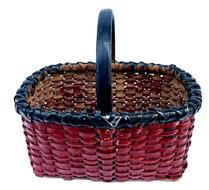 M275 EXCELLENT early 20th century small sized hand-woven splint gathering basket possibly of North Carolina origin bearing the original black and red painted surface. The rectangular form boasts tight weave with a double wrapped, double rim with handle that is woven into the sides and secured with a small tack on each side. Appears to be made of white oak and river cane construction, which is typical of NC baskets. No breaks or losses and very minor flaking to the paint. Measurements: 9 ¼ x 6 ¾ x 5 tall sides. ~8 ¼ tall including handle.