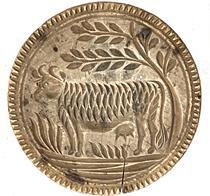 K55 19th century chip-carved butter print stamp of Pennsylvania origin boasting a deeply carved Cow design. There is a small age crack from wood shrinkage. Very dry, natural patina surface. Measurements: 3 tall x 4 5/8 diameter