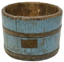 **SOLD** M250 Late 19th century Pennsylvania Dry measure in early dry blue painted surface. Thick walled staved and bentwood construction secured with two metal bands. Branded 4 QTS. Along the top edge and bears an original brass label that reads: FROM MICHELLS SEED HOUSE 518 MARKET ST PHILA. Great wear and patina from age and years of use. These were used in general stores to measure out dry goods such as grains, sugar, etc. (Research indicates Michells Seed Company was started in 1890 and moved into the location at 518 Market Street in 1900.) Measurements: 9 top diameter x 8 ½ bottom diameter x 6 ¾ tall sides.