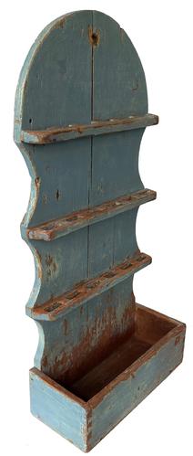 F219 Charming New England early 19th Century spoon rack, with cutlery box or candle box retains old blue paint over original red. This wall hanging rack with hold eighteen spoons, with the open dovetailed box at the bottom, tall arched and shaped back measurement are 26 ½” tall 12 ½” wide 5 ¾” deep