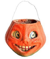 L311 1930s Paper Mache Pulp Pumpkin Smiling Jack O Lantern. Circa 1930-1940s. The lantern retains great original orange and green surface with what appears to be its original wire handle and paper insert for eyes and mouth. M E M 15c is written on the top edge of the opening. Great condition! Pumpkin measures ~ 7 at widest point x ~6 deepest point x and is 5 ¼ tall not including handle.