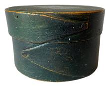 RM1081 Very early Massachussets Miniature round finger- lapped pantry box in beautiful Windsor green paint. The wood is Maple with a Pine top and bottom. This style pantry box with opposing lapped fingers is attributed to the "Harvard Shaker" style as seen in the Harvard, Massachusetts Shaker Community of the 19th Century. This size was usually used for medicines/pills. Measurements: 3" diameter x 1 7/8" tall