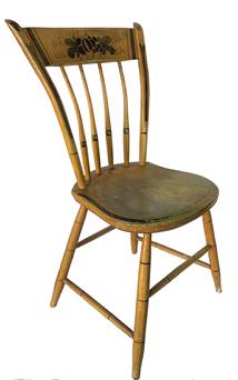 F128 Mid 19th century,THUMB BACK WINDSOR CHAIR IN YELLOW PAINT. Having straight crest rail mortised into carved and turned uprights with turned spindles having a carved shaped seat on simple bamboo turned base. With yellow paint with painted banding and Original yellow paint with green, black and gold stenciled fruit on the crests. . SIZE: 34" H, 15-1/2" L, 15-3/4 D.