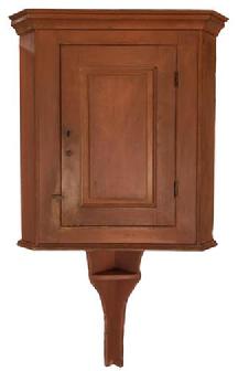 E579 Late 18th century Lancaster County Pennsylvania Hanging Corner Cupboard, with an extending tail with shelf, original salmon paint, circa 1780 - 1810