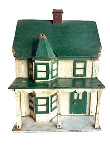 L310 Folk Art Bird House bearing its original green, white and Spanish red painted surface. It has two chimneys and a lot of character with the front bump out with hexagonal roof, overhanging porch with scalloped trim and individual posts, and applied windows and doors. The wood is pine with small wire nail construction. Early to mid-20th Century. Measurements are: ~17 ¼ deep x ~ 10 ¼ wide x ~15 tall.
