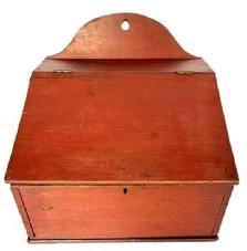 M52 Large 19th century Lancaster County, Pennsylvania Wall Box with hinged lid and arched tombstone back in original red painted surface. The wood appears to be poplar with dovetailed case with square head nail construction and hole in top for hanging purposes. Circa 1820s-1830s. Measurements: 13 ¼ wide x 11 ¼ deep x 5 ¾ tall (front) x 11 ½ tall (back)