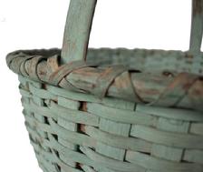 B334 Virginia gathering Basket with the dry blue paint. Nice high steamed and bent handle. The rim is double wrapped with a kicked in bottom. Very well made. It has one small break, overall very good condition. Tight weave and heavy.