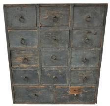 D427 Late 18th century New England fourteen drawer Apothecary Chest, circa 1790 in the original pewter gray paint. Tee nail and square head nail construction, with all the original brass pulls. The drawer dividers are mortised into the case. Very unique drawer layout with twelve small drawers over two large drawers