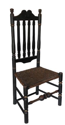 E305 Early 18th century New England Banister back Chair, 19th century black paint over the original 18th century salmon, original woven seat, robust turnings, true acorn finial, a tombstone top rail circa 1740 Measurements are 41" tall x 19" wide x 14" deep