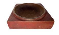 **SOLD** K195E 19th century treenware square hand carved wooden mortar chopping bowl / soap dish bearing original red painted surface. A raised lipped edge surrounds the opening. Natural patina interior boasts extensive wear indicative of age and use. Overall measurements: 7 x 7 square x 2 thick. The opening is ~5 ¾ diameter.