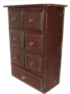 C513 Seven Drawer Spice Cabinet circa 1880 six small drawers over one large drawer in simple nail construction with old red surface