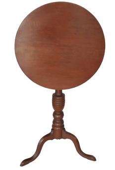 E108 18th century New England tilt top Candle Stand, in original red painted surface . It is from New England, circa 1790-1800. The round top is affixed to an attractive baluster turned column , supported by three wide cabriole legs, ending in a snake foot Dimensions: 19 3/4" diameter top 29 1/4" height. top up 39 3/4”