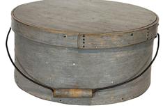 F437 Largge 19th century New England large bail handle Pantry Box in the original pewter gray paint. Ash side with pine top and bottom; clinched nail and wood-peg construction; wire bail-handle with turned wood grip.  Measurements are: 15" diameter x 7" tall