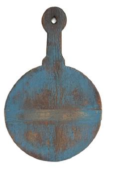 **SOLD** M12 Early 19th century wooden Peel Board / Cutting board with shaped handle and hole for hanging with remnants of its original blue painted surface on one side and natural patina on the reverse. The runners you see showing are actually the bottom of the peel board, but for display purposes, it looks more interesting with the runners showing. The opposite side is perfectly flat for working on and bears wonderful patina from years of use. Measurements: 25 ¼ long x 16 wide x ¾ thick.