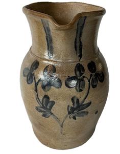 **SOLD** K1742 19th century cobalt blue decorated Stoneware Crock Pitcher attributed to Peter Hermann (1825-1901) of Baltimore, Maryland.  Decorated with brushed cobalt flowers on front and the collar is decorated with flowers and swags on each side of spout. Circa 1840s-1860s. Measurements: 6 bottom diameter x 10 ½ tall.  