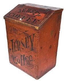 L271 Late 19th century General Store Coffee Bin for “Jersey Coffee” with its original pumpkin painted surface advertising “100 pounds Jersey Coffee” stenciled in black on the front, and “Pittsburg Pa ” stenciled on the back. Hinged slant front lid on top bears “Jersey Coffee” and “Dayton Spice Mills Dayton O.” in black with black pin striping. Applied molding surrounds the lid. Clean, natural patina interior. Circa 1885 – 1890’s. (NOTE: “Jersey Coffee” was a specialty brand of the Dayton Spice Mills Company, established in 1885.) The wood is pine. Measurements: 22 ¼” wide x 17” deep x 31 ¾” tall (back) x 27 ¼” tall (front).