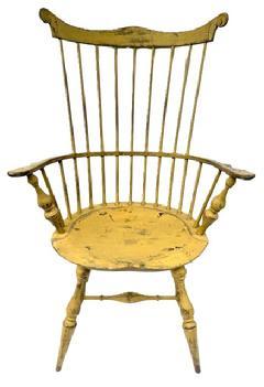 E494 Bench made Rhode Island nine spindle comb back Windsor Armchair in beautiful mustard yellow painted surface. Signed on bottom. Measurements: Seat is 20 ¾ wide x 16 ¼ deep x 17 tall. Overall height in back is 42 ¾ tall. 26 ¼ wide across arms.