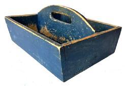 J352 19th century Pennsylvania original Soldier Blue painted Cutlery tray / knife box with curved center divider featuring an oval cutout for carrying purposes. Slightly canted sides. Square head nail construction. Very dry surface with wear indicative of use. Circa 1840 1850s. Measurements: 13 ¼ x 11 3/8 x 6 tall (center). The sides are 4 tall.