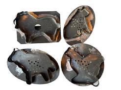 K1879A Group of four animal shaped flat backed Tin Cookie Cutters with handles. All solder joints are secure. Lion cutter measures 4 ¼ wide x 3 tall. Both oval ones are 4 ¼ wide x 2 ¾ tall and the chicken measures 3 ½ in diameter.