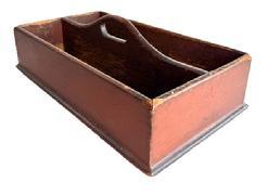 L420 19th century Pennsylvania Cutlery Tray / Knife Box retaining its original red painted surface. Raised curved center divider features cut out for carrying purposes. Molded edge surrounds the bottom. The wood is pine with tiny square head nail construction. Very dry surface with wear indicative of use. Circa 1840 1850s. Measurements: 16 ¾ wide x 9 ½ deep x 3 ¾ tall sides x ~5 ½ tall at handle.