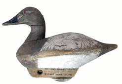 E373 Early Canvasback Hen with very unusual hand-chopped body and wooden keel with iron weight. Glass eyes. Tight crack to the neck. Circa 1940s Bishop Head Club - Maker unknown.