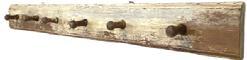 K1545 18th century Lancaster County, Pennsylvania peg rack bearing remnants of original oyster white painted surface and early rosehead nails. Peg rack features molded edges on both top and bottom edges of the back board and six (6) sturdy pegs with bulbous ends. Measurements: 51 ¾ wide x 5 ¾ tall. Each of the pegs are approximately 2 ½ deep.