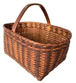 K1837 Spectacular Eastern Shore, Maryland Basket featuring a double banded, single wrapped rim. The steamed and bent handle is actually one solid piece of wood that encircles the center of the basket and is incorporated into the weave. Nice, tight weave, featuring two different brown colored oak splint slats. Very sturdy. Excellent condition. Measurements: The opening is 13 ¼ long x 9 wide. Rectangular bottom is 10 ½ long x 8 wide. Sides are 6 ¼ tall. Overall height at handle is approximately 10 ¼ tall.