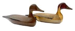 L203 Pair of miniature Pintail decoys carved by Robert (Bob) McGaw (1879-1958) of Have de Grace, Maryland bearing their original painted surfaces. Tight crack to the neck of each. Approximate measurements: Drake: 7� long x 2� wide x 3� tall.  Hen: 6 &frac34;� long x 2� wide x 3� tall.  