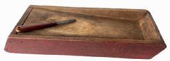 **SOLD** RM1482 Simplistic double-sided scrub / scouring box with great wear to one side and wonderful dry red paint. Slanted work surface on both sides. Tiny square head nail construction. Circa 1840s. (Knife included.) Measurements: 15 ½ long x 6 wide x 2 tall.