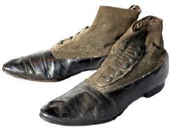 K1877 Pair of 19th century button top leather and canvas Shoes / Boots the soles read SelZ Chicago and The Sole of Honor. Each of the shoes retains their original 7 buttons. SELZ is a brand of footwear manufactured and distributed by Chicago-based Selz, Schwab & Co. (1890-1929) and was known for the slogan SelZ Shoes Make Your Feet Glad. Approximately 11 ½ long x 3 ½ at widest point x 5 ¼ tall.