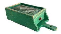 RM1630 Early wooden box grater with drawer retaining its original dry green painted surface. Grater boasts a hand punched perforated, heavy metal grater surface over a sturdy full length functional drawer that slides in and out without problems and has a small knob for easy opening/closing. A cut-out handle with hole for hanging purposes and shaped ends by the drawer opening add to the visual appeal to this functional kitchen necessity. Maker attached a 5/8 wide strip of wood across the back to slightly elevate the upper end of the grater when in use. Great wear indicative of age and use. The wood is pine with small wire nail construction. Circa 1880s 1900. Measurements:15 5/8 long x7 1/8 wide x 4 tall.