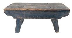 M73 Late 18th century original blue painted Stool featuring half-moon cut out design on each leg/end of the stool and a drop apron on each side that is mortised into the legs. The splayed legs are double mortised through the top. Very sturdy. The wood is walnut. Measurements: 13 ¼ long x 6" deep x 5 ¾ tall.