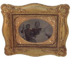 RM221 Mid 19th century Civil War Era very nice Family image, with small Boy holding the American Flag. In one of a kind gutta-purchase frame circa 1860