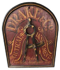 SP8 Wooden Trade Sign adversting Drake & Co. Nautical Instruments, this sign is has applied molding, great colors of red background with gold lettern, with black trim Measurements are:25 1/2" x 20"
