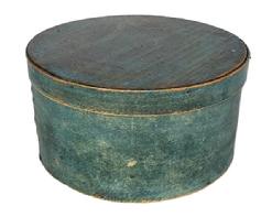 G524 19th century pantry box in original blue paint with remnants of proprietors stamp on top of lid. Steamed and bent wood is held in place with tiny wooden pegs around top and bottom and tacks secure the overlaps. Wonderful natural patina inside. Measurements: 5 tall x 9 3/4 diameter (top) x 9 1/2 diameter (bottom). 
