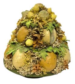 M200 Original Folk Art Fruit Arrangement attributed to Doris Stauble (1917 - 2007) of Wiscasset, ME. Doris was a documented folk artist who created arrangements from 19th century Victorian millinery supplies. This arrangement is in good condition and consists of an abundance of lemons and artificial foliage arranged in a shallow woven basket with footed base and green painted edges. Circa 1950. Approximate measurements: ~9 diameter x 9 tall at center. Rests on footed base of basket that is 5 1/5 diameter.