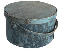  E491 Early New England 19th century wooden bail handle Pantry Box, with the original dark blue over the original blue  paint, heavy construction, tacked lap joint, bent wood swing handle with wood peg. 'HR' engraved into top of lid. Measurements are 11 1/2 " diameter x 7" tall