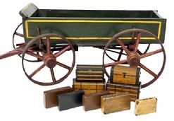 **SOLD** M1106 Wonderful, extremely detailed Salesman Sample wooden Box Wagon with "Luggage" bearing its original green, red and mustard yellow polychrome painted surface. Each of the nine (9) pieces of luggage are painted with details to simulate period suitcases and trunks, some with remnants of their original leather handles. Removeable box reveals the exceptionally detailed and well-made, working chassis. Solid wood and sheet iron construction with sheet iron realistically encircling each of the wheels. Overall measurements are 27 ¾ long including yoke x 10 ½ wide at rear wheel centers x 8 ¼ tall at front of wagon. Internal depth of wagon is 2 ½ deep. Luggage measurements range from smallest at 2 ¼ wide x ½ thick x 1 ½ tall to largest at 3 ½ wide x 1 7/8 deep x 1 7/8 tall