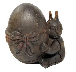 M216 19th century hand carved wood Rabbit hugging an Oversized Egg with large bow Papier Mache mold retaining its original surface. Solid hand-carved wood construction with great details, and a large surface crack from age and drying of the wood. This type of mold was used as a pattern to make Papier Mache Christmas, Easter and Halloween items. You can see fine knife cuts throughout, especially on the ears, where the Papier Mache was cut away when dry. A cute decorative piece of history. Approximate measurements of the Putti are: ~11 ¼ wide x ~8 deep x ~12 tall.