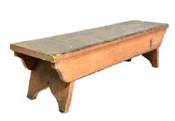 M1135 Pennsylvania splay leg stool bearing original salmon painted surface with scrubbed top. Double drop aprons are mortised into the legs which end in decorative cut out feet. The wood is pine with square head nail construction. Measurements: 26 3/8 long x 7 deep x 7" tall.