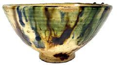 L334 19th century blue and white Spongeware bowl featuring the classic sponge-applied blue speckled pattern with two solid white and a solid blue band in center. Interior also boasts blue and white decoration. Tapered lipped rim and raised footed bottom. Measurements: 14 5/8 top diameter x 7 ¼ bottom diameter x 5 tall.