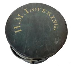 F152 Mid 19th century Firkin in original Windsor green paint with the name " H.M. Lovering." painted on lid. This firkin is constructed of wooden staves and pegs, bentwood handle and lap joints, copper tacks to hold the bands in place and is in very good condition. Measurements are: 11 1/2" top diameter x 12 1/2" tall