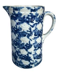 K1684 Rose Embossed Blue Spongeware Pitcher - Circa 1880s 1890s. Great condition with one visible turkey track on interior glaze at top rim. Measurements: 5 ½ bottom diameter x 9 tall.