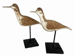 K66 Early 20th century pair of Shore Bird rig mates each is branded "T. SMITH". They have wooden beaks/bills, tack eyes and the surfaces bear remnants of original paint as well as evidence of being shot over. Mounted on newly made, black painted wooden bases for display purposes. Each bird measures approximately 11 long x ¾ wide x 5 ½ tall. Mounted heights are 9 ½ tall and 10 ½ tall.
