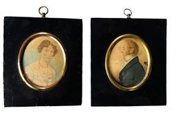 L28 Exceptionally detailed hand painted pair of miniature framed watercolor Portraits featuring a very distinguished, well-dressed man with glasses and a lovely curly-haired lady wearing a beautifully adorned bodice with several strands of beads and delicate earrings. Circa early 1800s. Measurements: 4 ½” wide x 5” tall. Oval portrait area is 2 ¾” wide x 3 ¼” tall.