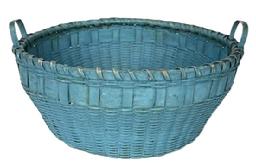 J37 19th century New England original blue painted round utility basket with attached steamed and bent side handles.  Tightly woven with single wrapped rim with bumped up bottom inside the basket for added air flow.  Great condition. Circa 1880s. Top diameter (slightly out of round) is 12 ½ x 13" diameter. Sides are 5 ¼ tall. Bottom measures 9 ½ diameter.  
